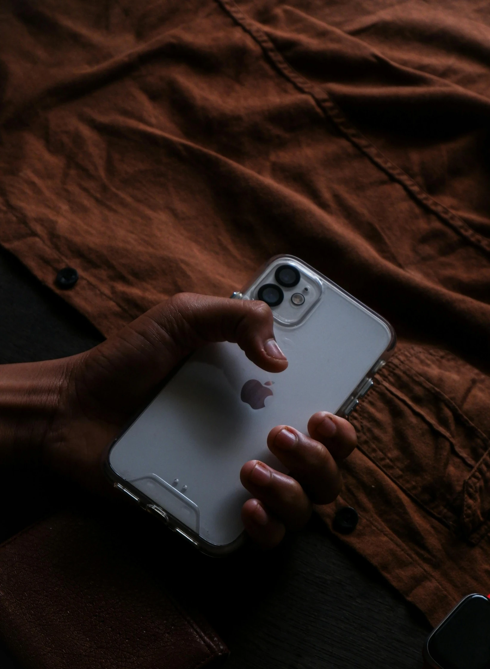 a person's hands with their cell phone