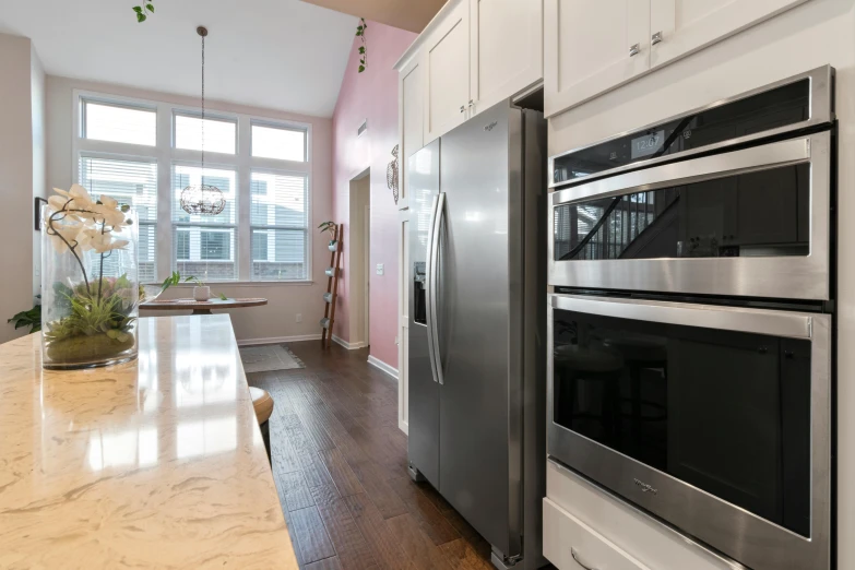 the interior of a kitchen with stainless steel appliances