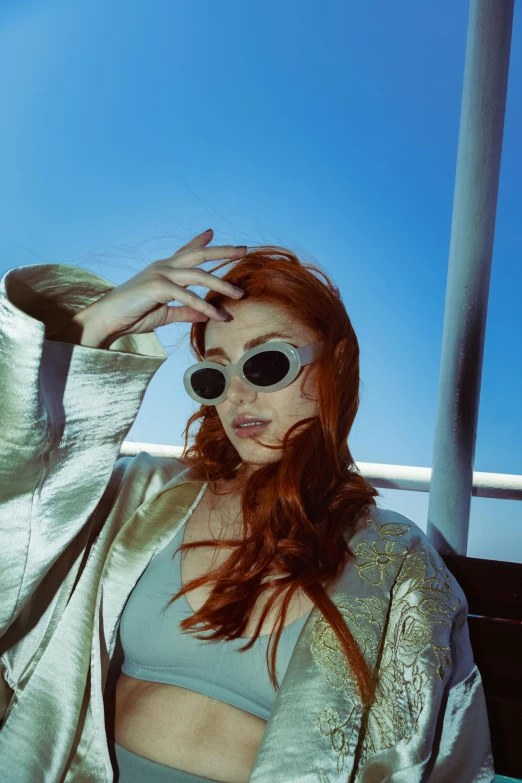 a woman with red hair and sunglasses on a boat, inspired by Elsa Bleda, trending on pexels, renaissance, ava max, slide show, gold hour, charli bowater