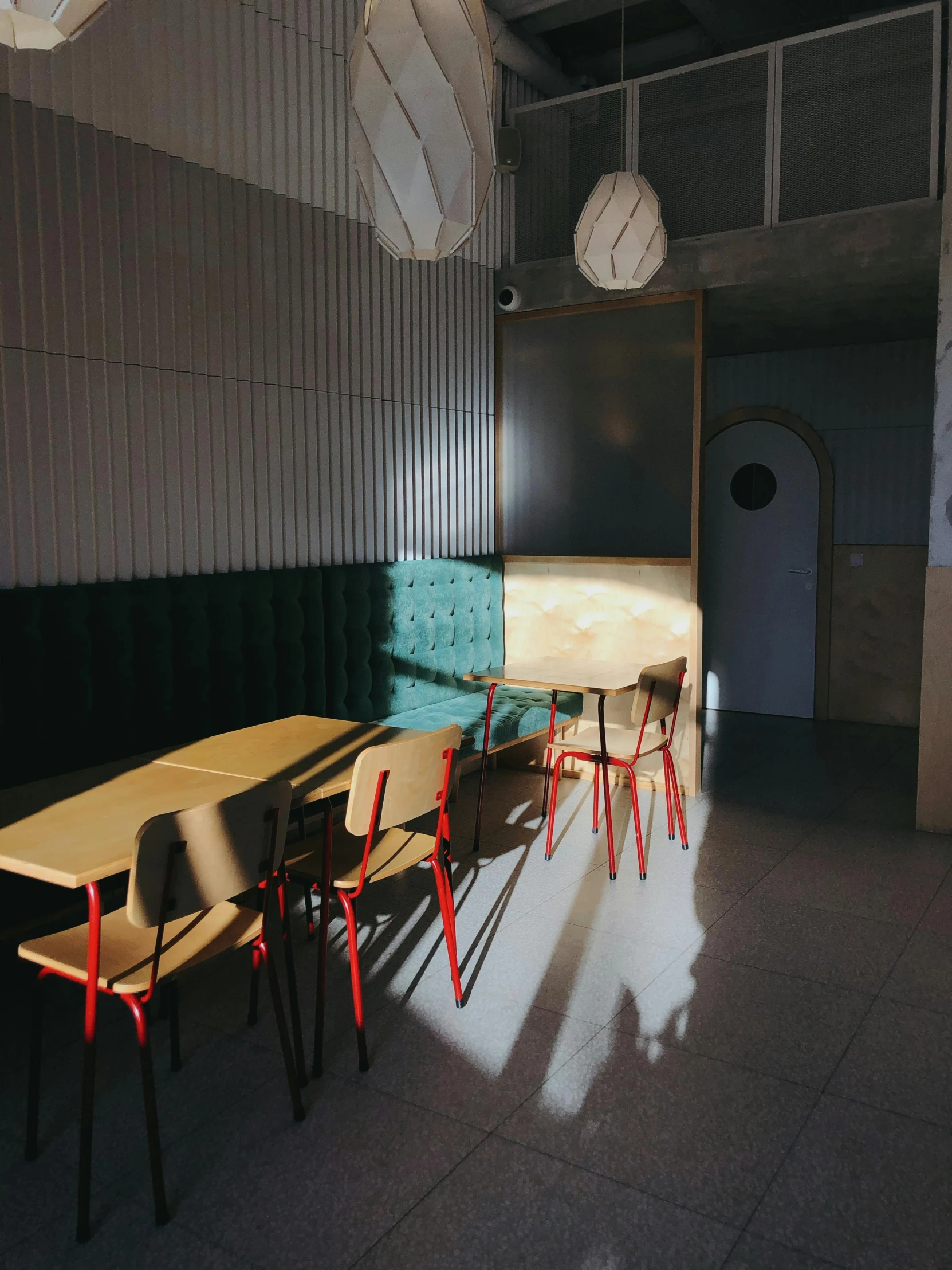 a room with several tables and a clock