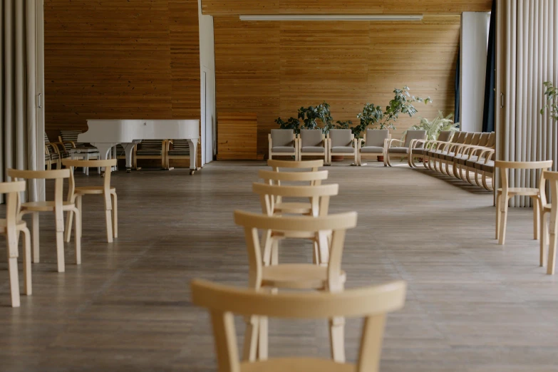 a church filled with wooden chairs and flowers