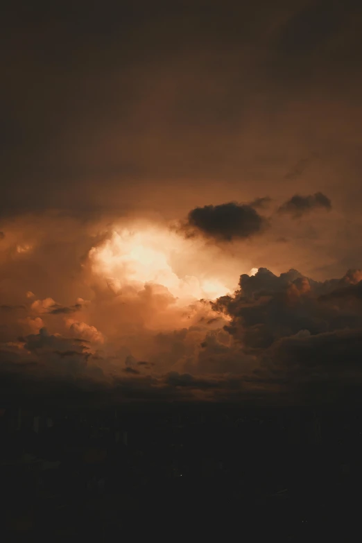 clouds in the distance with one cloud above them