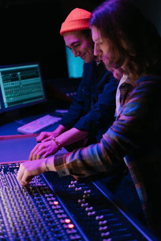 a couple of people sitting in front of a mixing desk, by Gwen Barnard, pexels, academic art, cinematic colors lighting, slide show, university, promo image