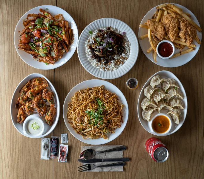 a number of plates of food on a table, vaughan ling, with fries, birdeye, 2 dimensional