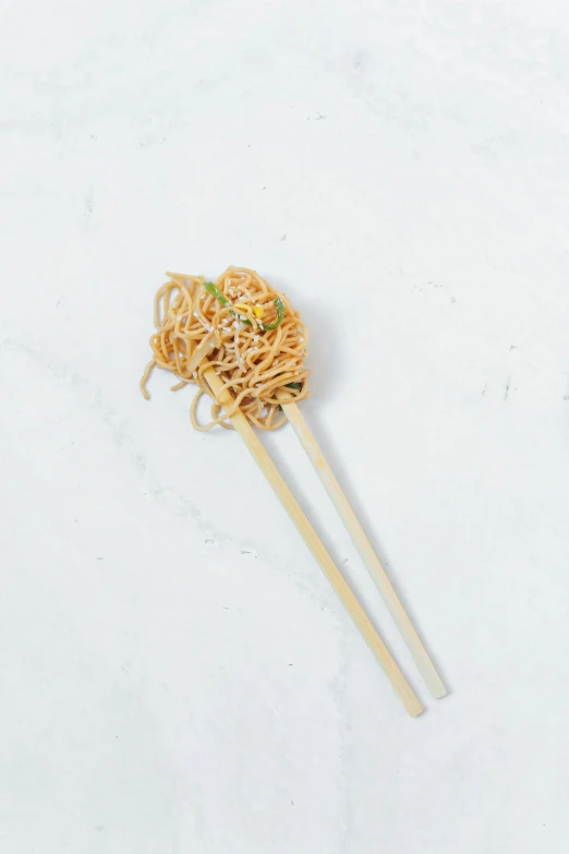 a pair of chopsticks with noodles on them, 3/4 front view, ballard, dreamy, us