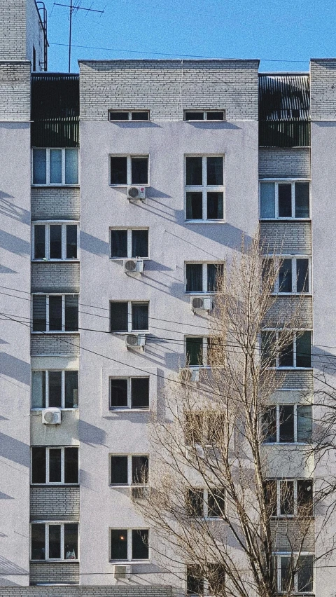 a red fire hydrant sitting in front of a tall building, by Attila Meszlenyi, brutalism, window ( city ), white houses, 15081959 21121991 01012000 4k