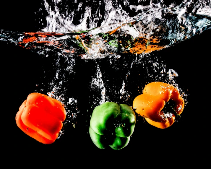 a group of peppers splashing into the water, by Matt Cavotta, pexels, process art, fan favorite, high contrast colours, organic and robotic, rectangle