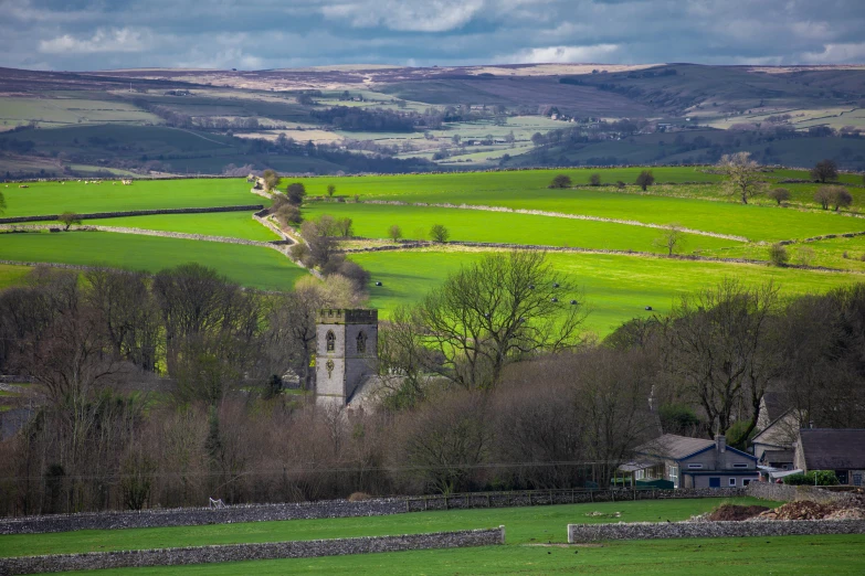 a view of a green hilly country side