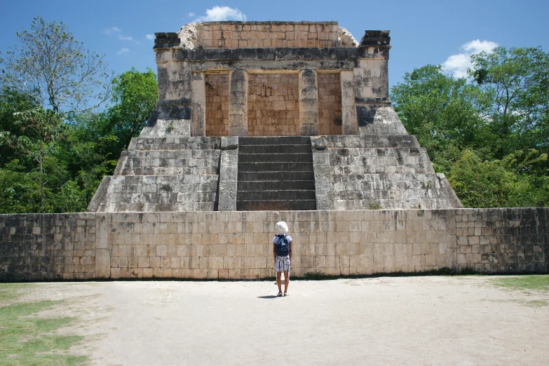 a man standing in front of a stone structure, maya temples, fan favorite, profile image, sunken square