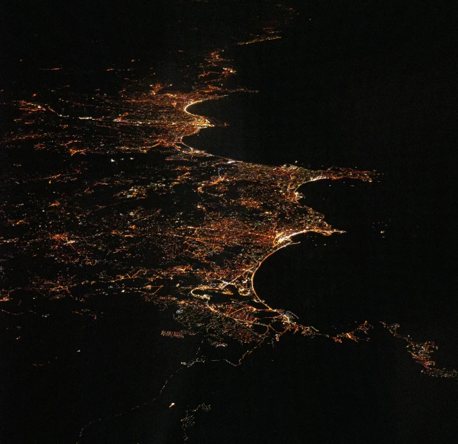 the night is seen from space showing lit up lights