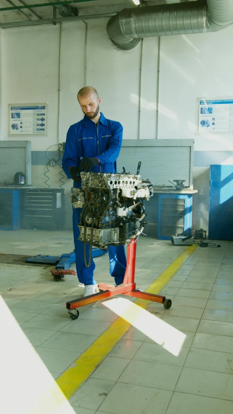 a man working on an engine in a garage, a picture, shutterstock, full body image, 1990s photograph, digital image, alexey gurylev