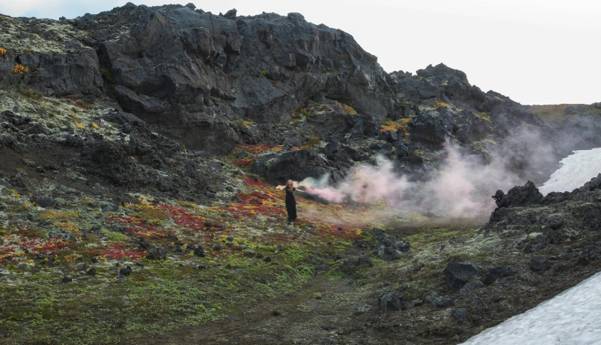 the man is traveling through the lava field