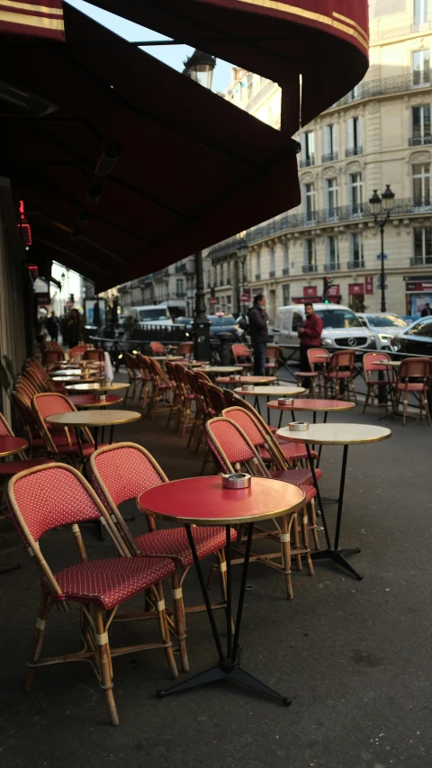 a street filled with lots of tables and chairs, pexels, art nouveau, pink and red color scheme, annie liebowitz, coffee, cinematic paris