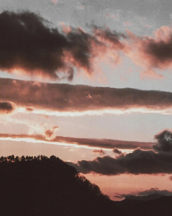 there is a plane that is flying in the sky, an album cover, pexels contest winner, romanticism, ☁🌪🌙👩🏾, red clouds, late summer evening, slight overcast