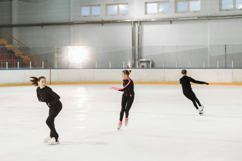 a group of people skating on an ice rink, arabesque, jovana rikalo, smooth art, commercial photo, shot on sony a 7 iii