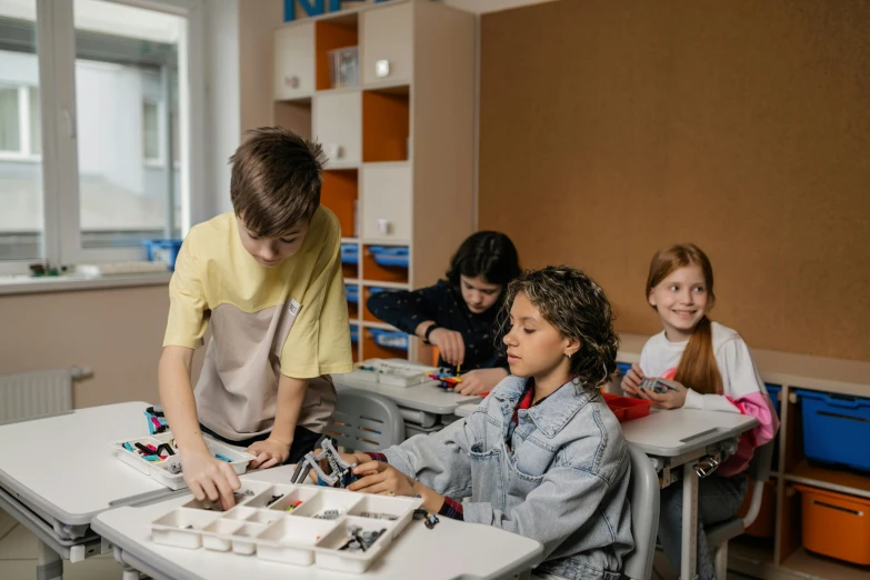 a group of children sitting at desks in a classroom, trending on pexels, danube school, holly herndon origami statue, avatar image, lego, 8k octan photo