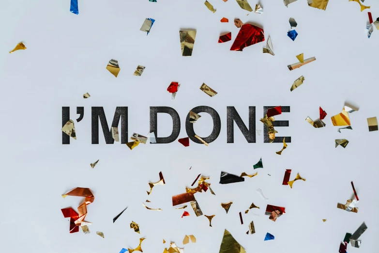 a sign that says i'm done surrounded by confetti, by Julia Pishtar, pexels contest winner, happening, work in progress, miles johnstone, thumbnail, no filter