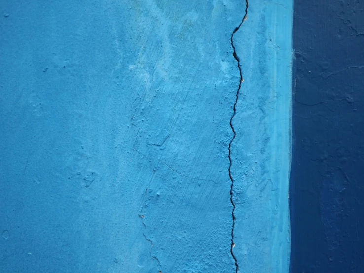 a blue wall with  from a fire hydrant