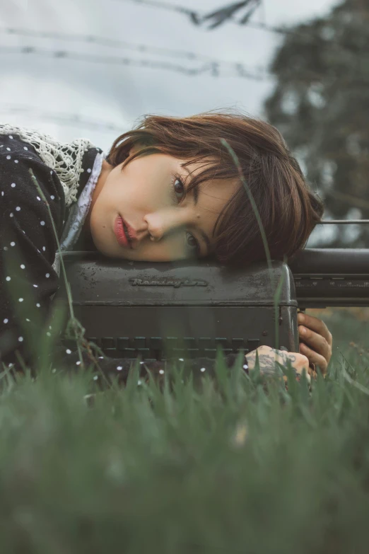 a woman with a freckled shirt laying down on a radio