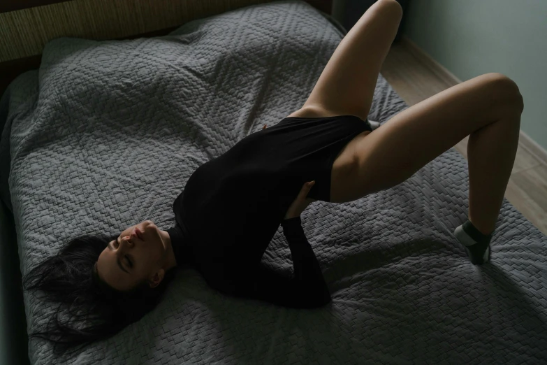 a girl laying on a bed in a room