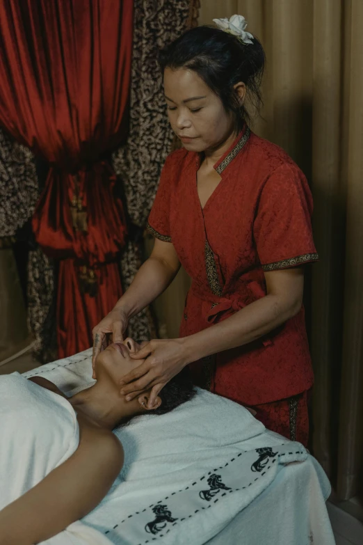 a woman getting a facial massage at a spa, a colorized photo, by William Berra, indonesia, slide show, old footage