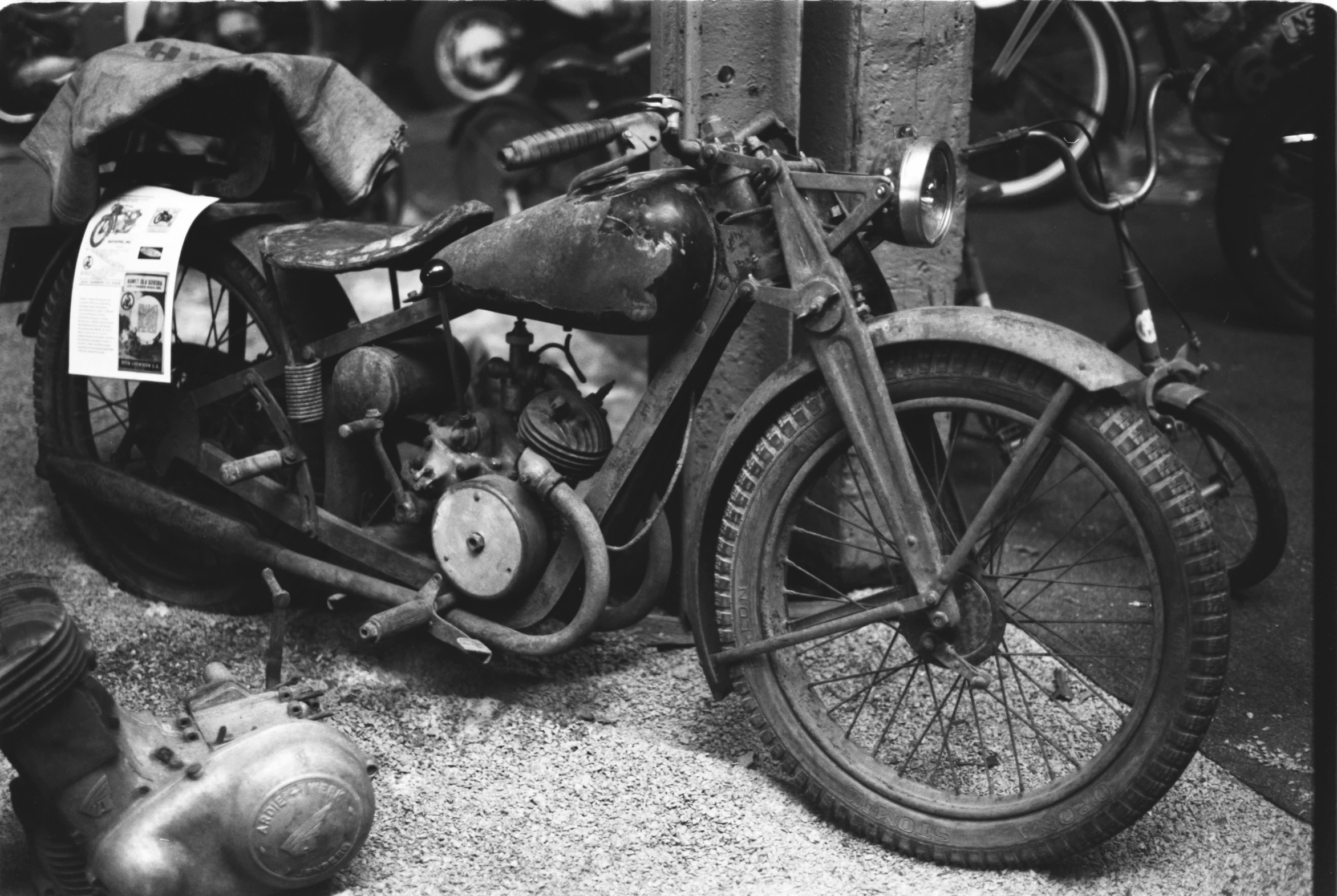 a black and white photo of an old motorcycle, by André Bauchant, broken down, early 20s, cleaned up, [ metal ]