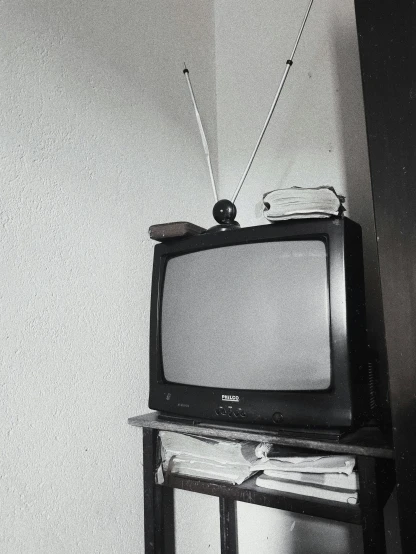 a black and white photo of a television set, a black and white photo, by Elsa Bleda, unsplash, instagram story, '9 0 s, an old balck and white photo, instagram post