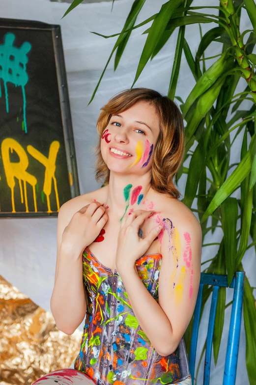 a woman sitting on a chair with paint all over her body, a portrait, pexels contest winner, action painting, in a colorful tent, sydney sweeney, cheery, ((messy))