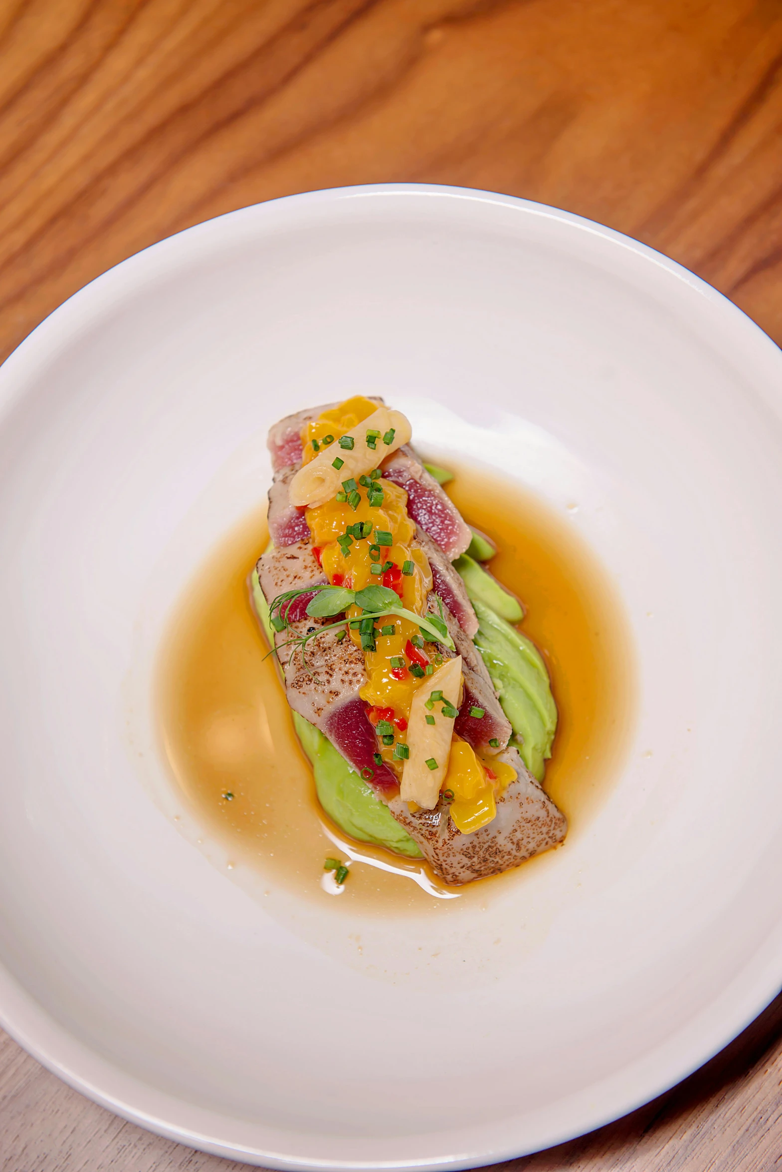 a close up of a plate of food on a table, inspired by Charles Le Roux, colorful fish, beef, koju morimoto, avocado