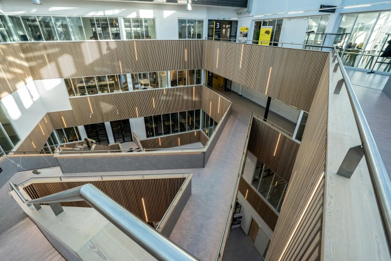 the interior of an architectural office building with many floors and doors