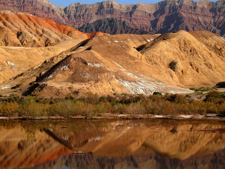 the mountains have orange and white paint on them