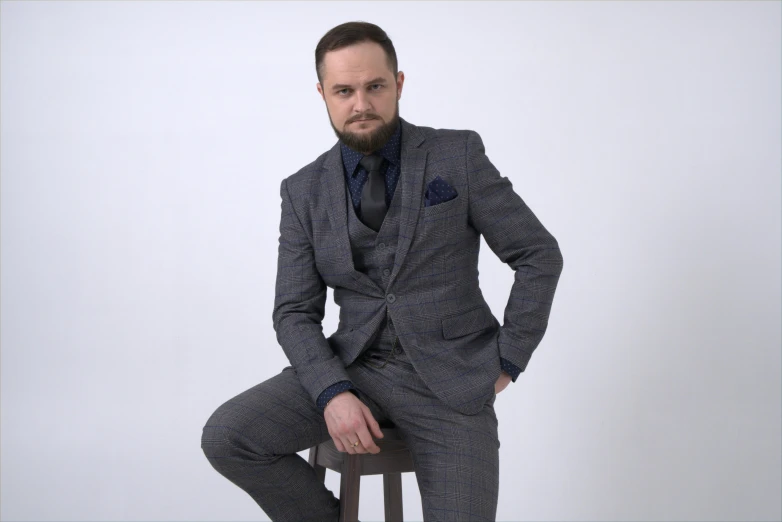 a man in a suit sitting on a stool, style of seb mckinnon, 3-piece-suit, twitch streamer / gamer ludwig, professional profile picture