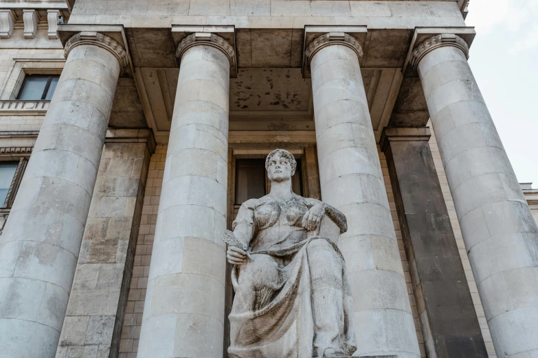 a statue of a woman standing in front of a building, inspired by Carel Willink, pexels contest winner, neoclassicism, the british museum, sitting on a stone throne, gigantic pristine marble columns, impressive detail : 7