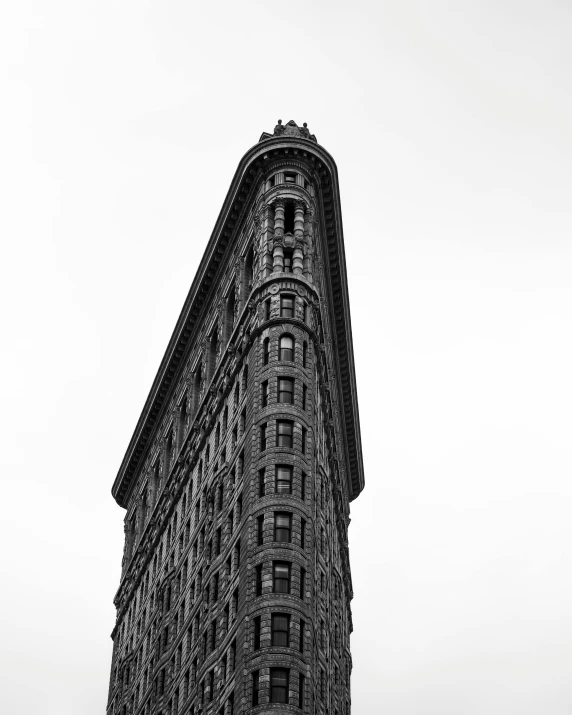 a black and white photo of a tall building, by Adam Rex, unsplash contest winner, art nouveau, square, in new york, flattened, viewed from the side