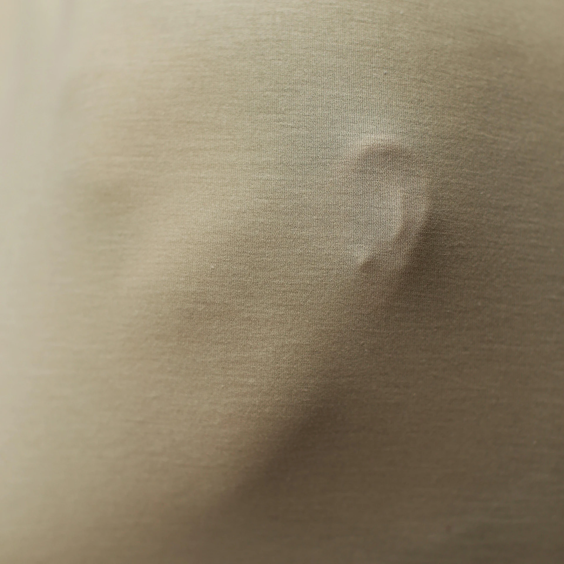 a close up of the back of a person's body, a macro photograph, by Mathias Kollros, trending on reddit, hyperrealism, soft translucent fabric folds, battle scar, tiny nose, soft sepia tones