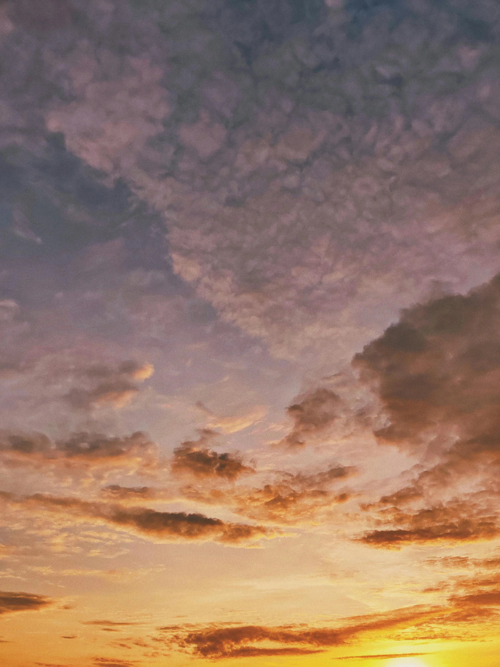 two planes flying in the sky above a sunset