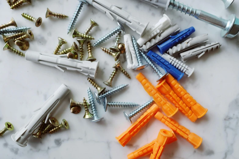 a bunch of screws sitting on top of a table, plastic ceramic material, sterile colours, ikea, levers