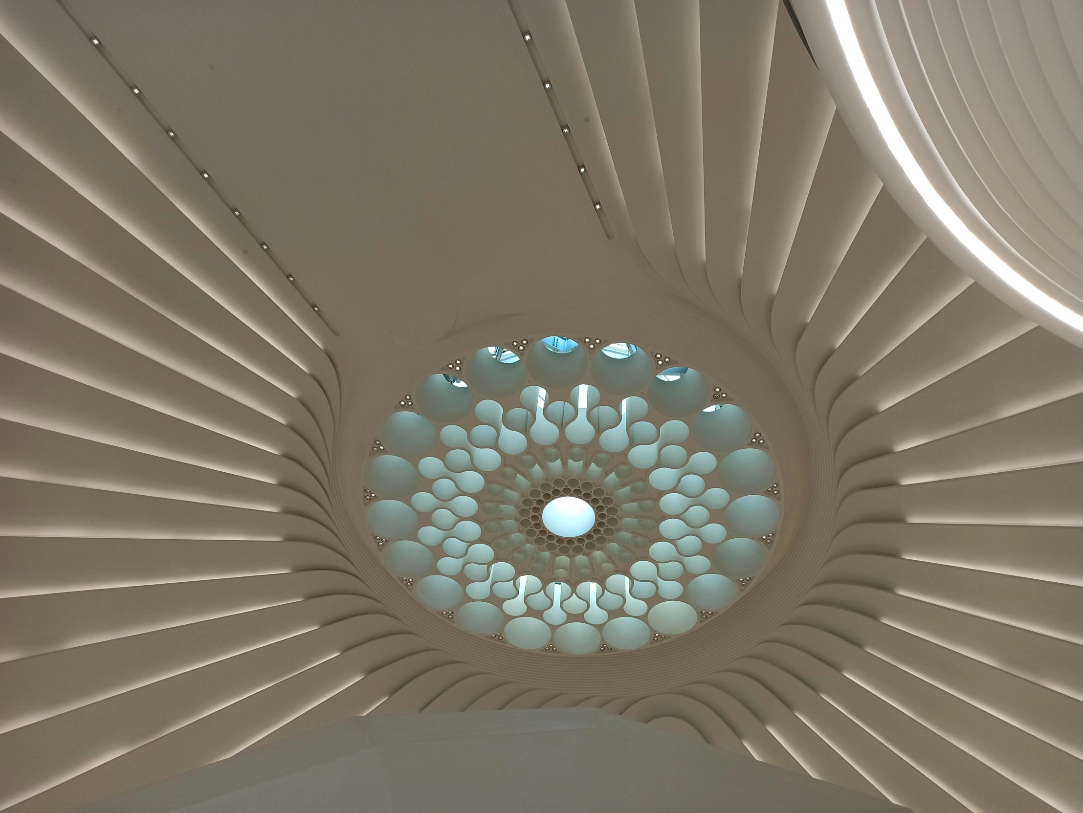 a circular window in the ceiling of a building, inspired by Zha Shibiao, paisley, jellyfish temple, white gallery, spire
