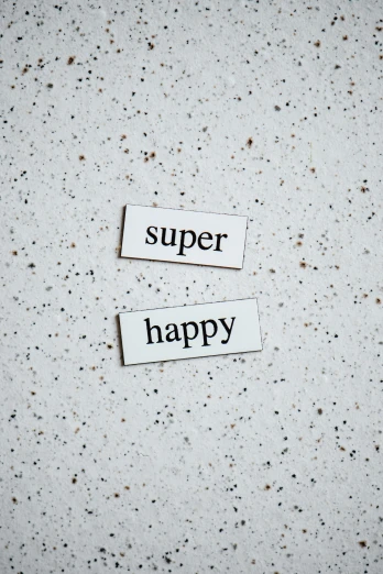 a piece of paper with the words super happy written on it, inspired by Harvey Quaytman, unsplash, superflat, magnetic, made of all white ceramic tiles, happy couple, supernova