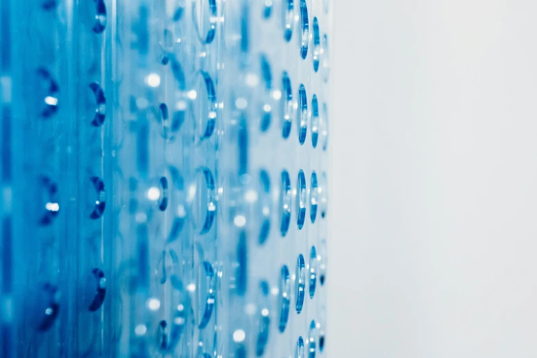 a close up of a shower head in a bathroom, by Konrad Witz, analytical art, blue translucent resin, made of dots, a blue skirt, hibernation capsule close-up