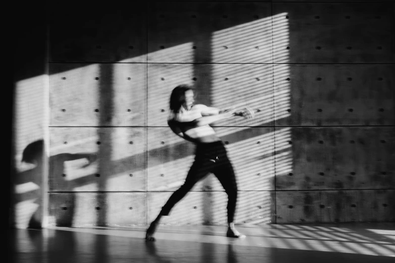 a black and white photo of a woman holding a guitar, a black and white photo, light and space, dynamic dancing pose, animation, bright daylight indoor photo, running