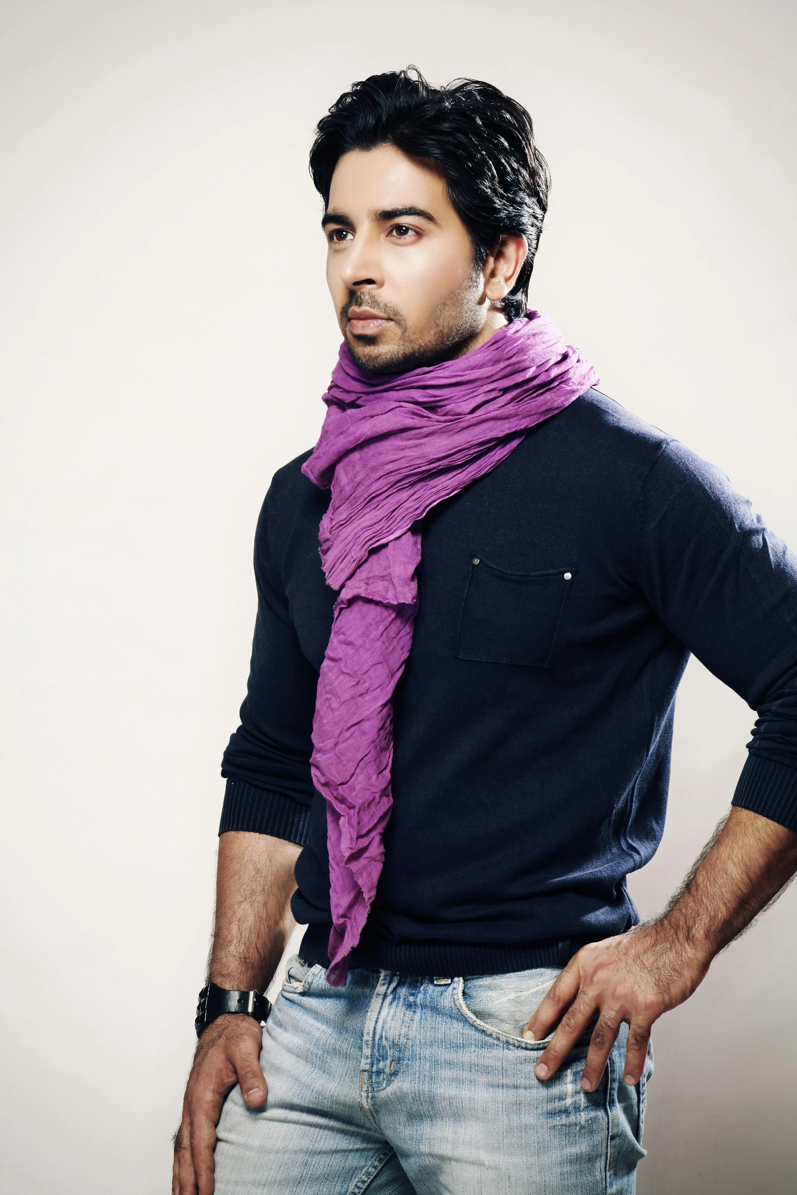 a man standing with his hands on his hips, an album cover, inspired by Nadim Karam, pexels contest winner, romanticism, wearing a scarf, violet coloured t-shirt, joe taslim, july 2 0 1 1