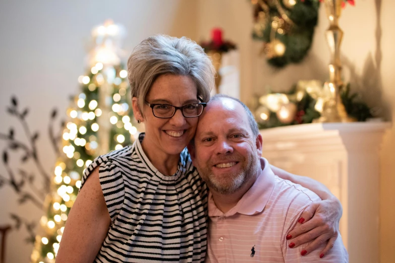 an older couple is posing together for a picture