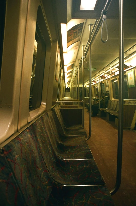 a passenger train is full of chairs and windows