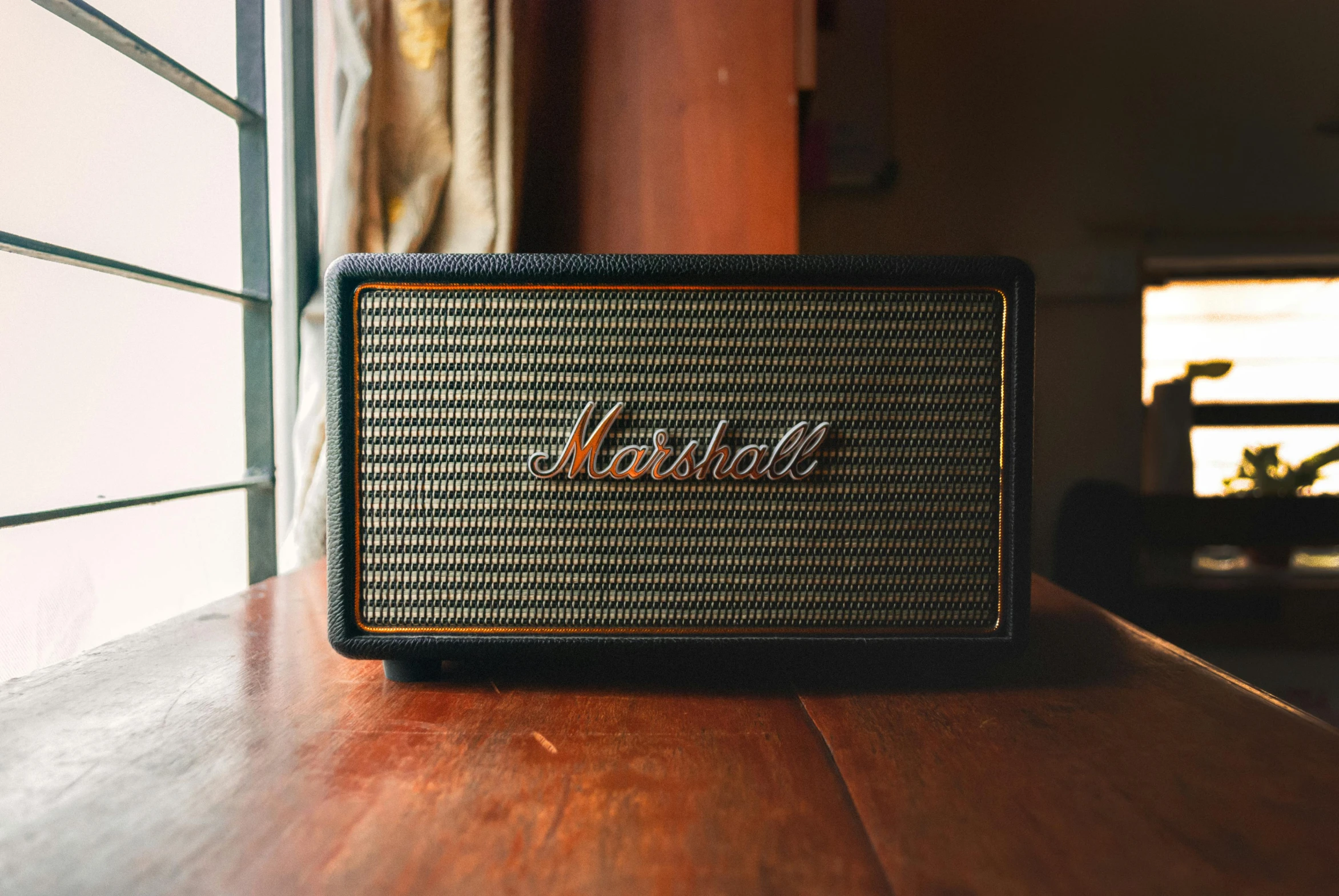 a radio sitting on top of a wooden table, by Marshall Arisman, unsplash, subwoofer, looking the camera, rectangle, soft shade