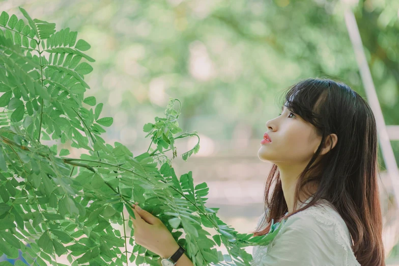 a woman that is standing next to a tree, by Tan Ting-pho, visual art, ulzzang, profile image, green plants, portrait image