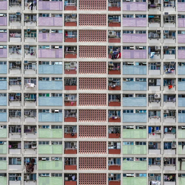 a very tall building with lots of windows, an album cover, inspired by Andreas Gursky, pexels contest winner, colorful houses, shan shui, color ( sony a 7 r iv, concrete housing