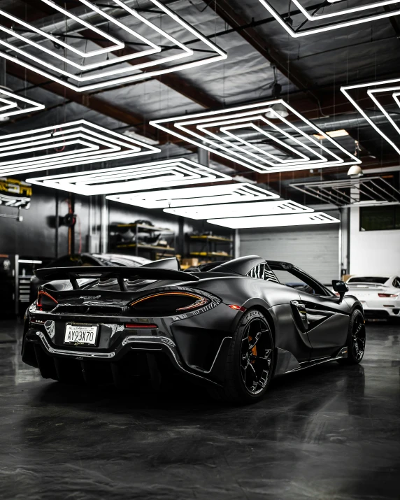 a black sports car parked in a garage, by Anthony Devas, pexels contest winner, hypermodernism, mclaren, 2 0 % pearlescent detailing, & jeehyung lee & wlop, rear lighting