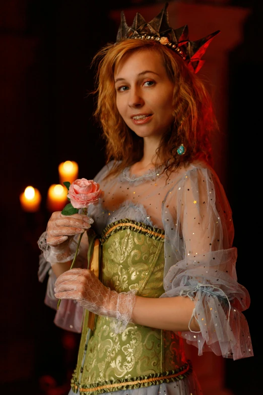 a woman in a green dress holding a flower, a portrait, inspired by Pierre Auguste Cot, renaissance, candlelit, promo image, princess peach), wearing corset