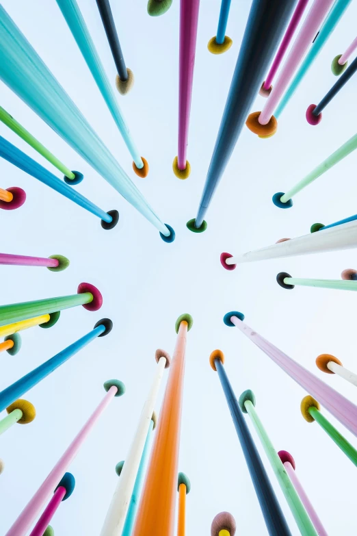 a sky filled with lots of different colored pencils, an abstract sculpture, unsplash, show from below, pool tubes, long tails, taken in the late 2010s